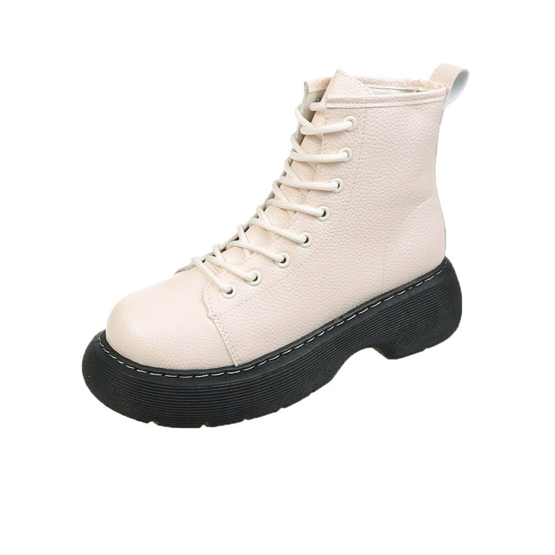 Beige boot with black sole on a white background