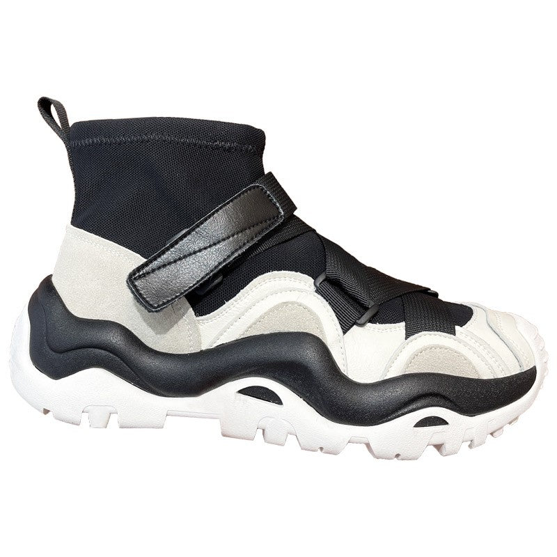 Black and white sneaker with velcro straps on a white background