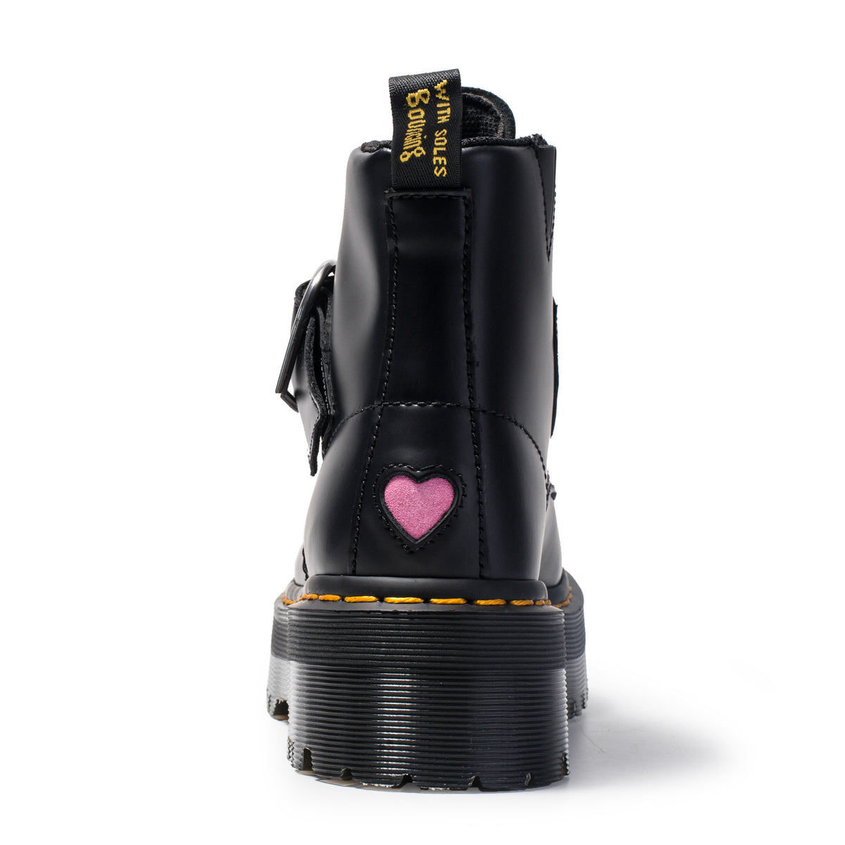 Black boot with a pink heart patch on a white background