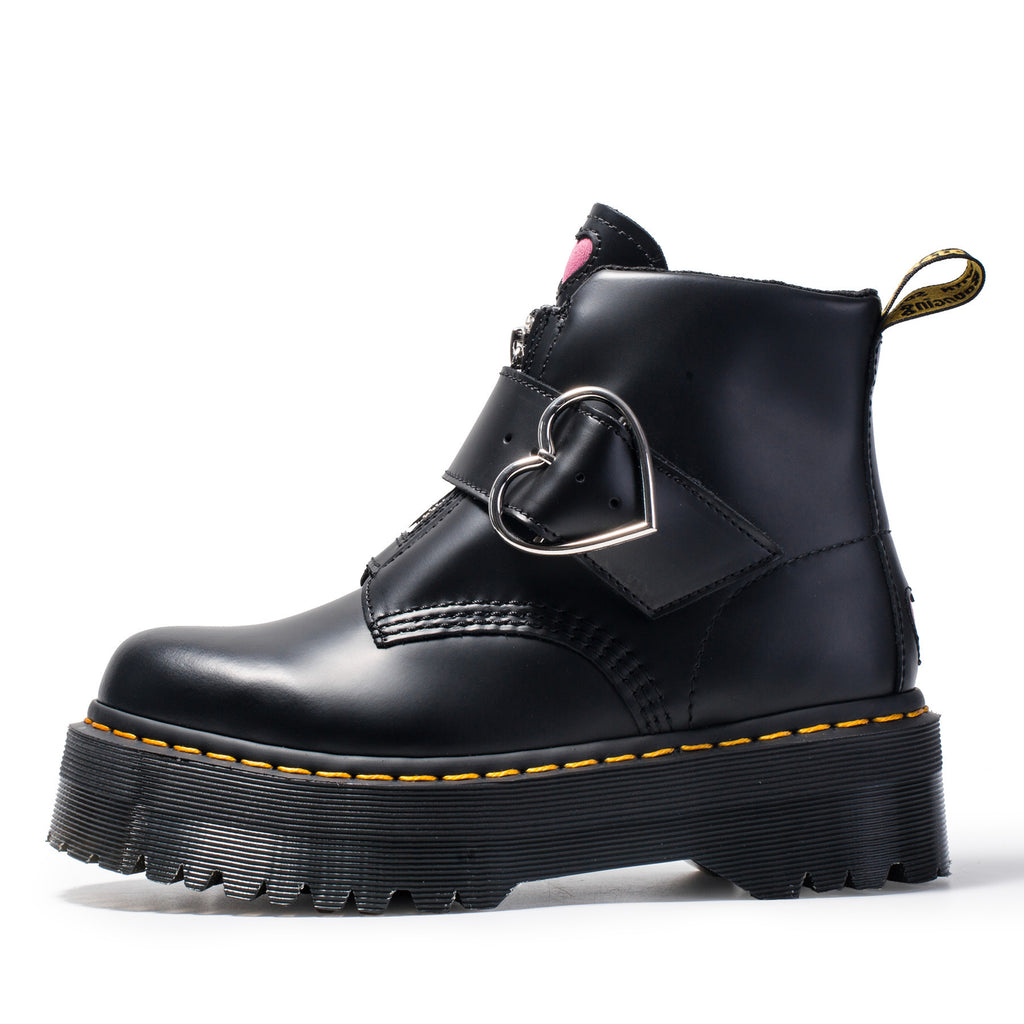 Black leather boot with heart-shaped buckle on a white background
