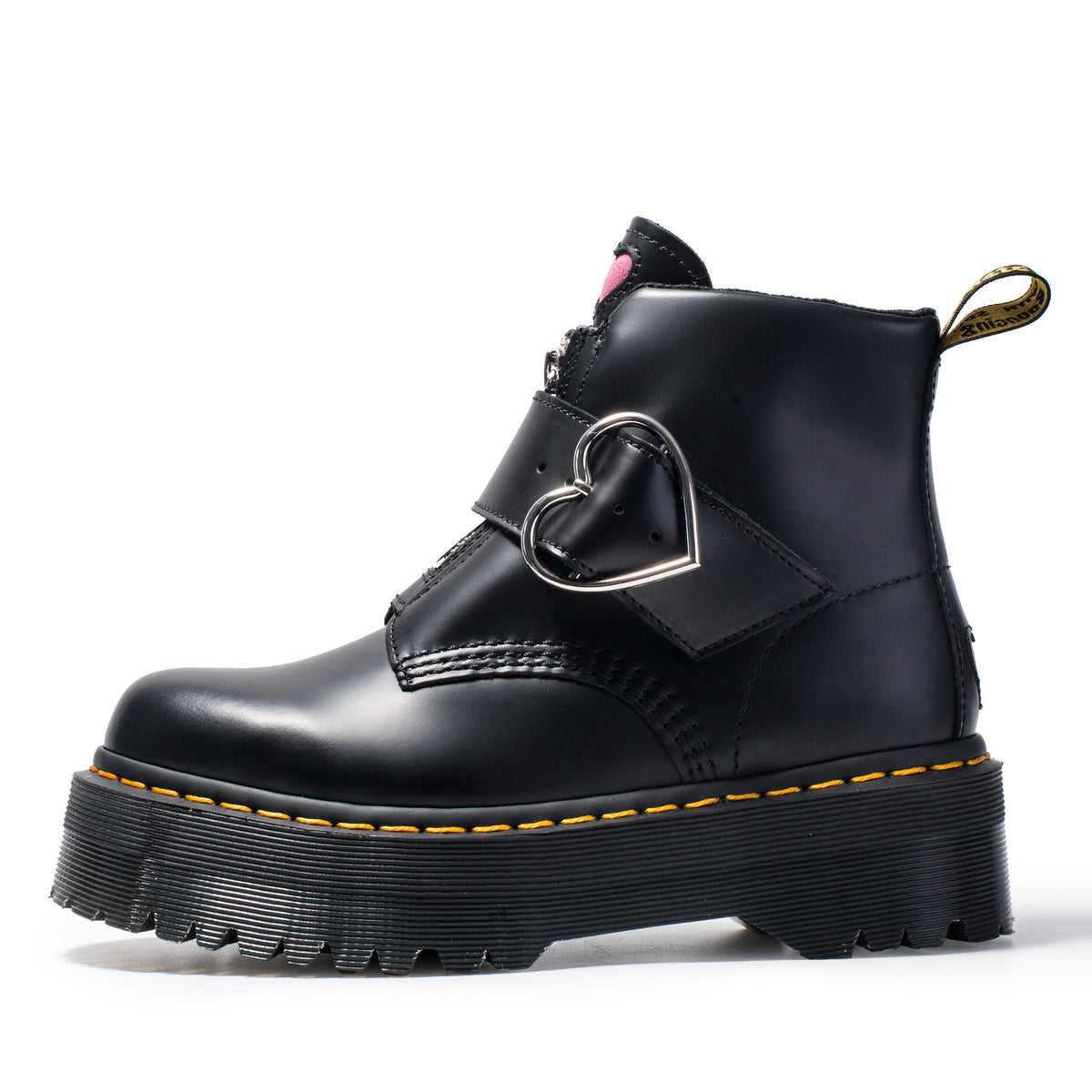 Black leather boot with heart-shaped buckle on a white background
