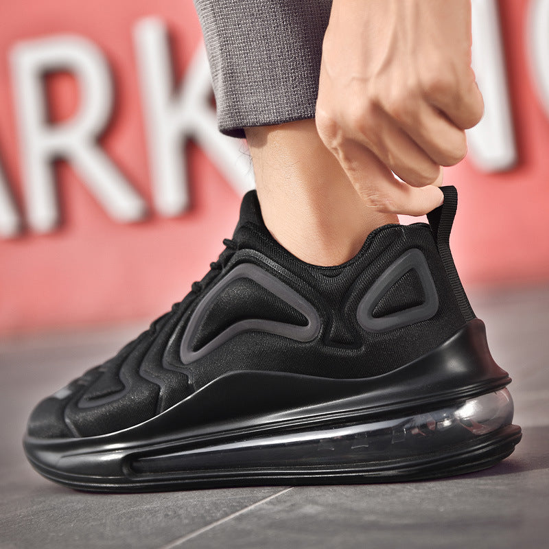 Black sneaker being worn with a blurred background