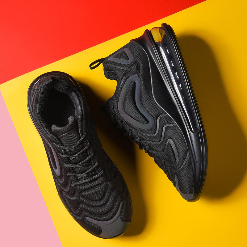 Black sneakers on a colorful geometric background