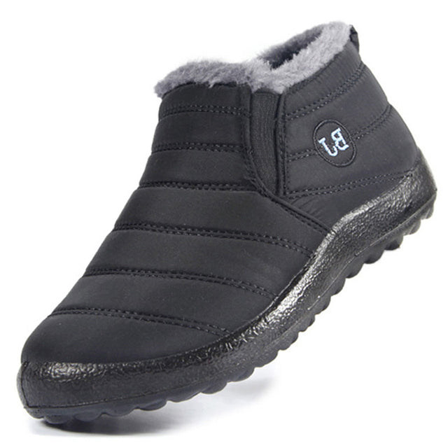 Black winter boot with gray lining on a white background