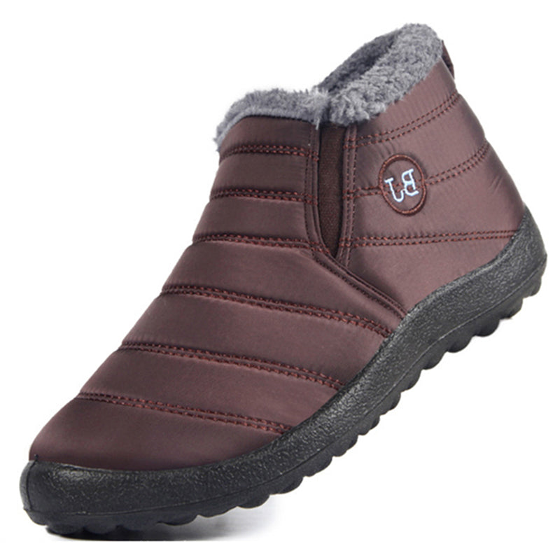 Brown winter slipper with gray fur lining on a white background