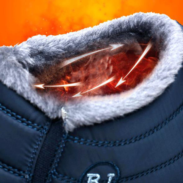 Close-up of a blue winter boot with heated insole on an orange background