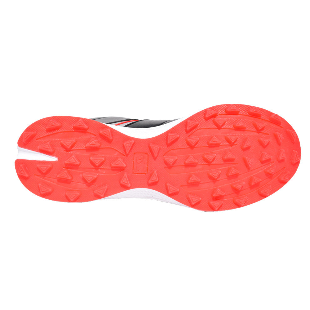 Close-up of a red sole with tread pattern on a white background
