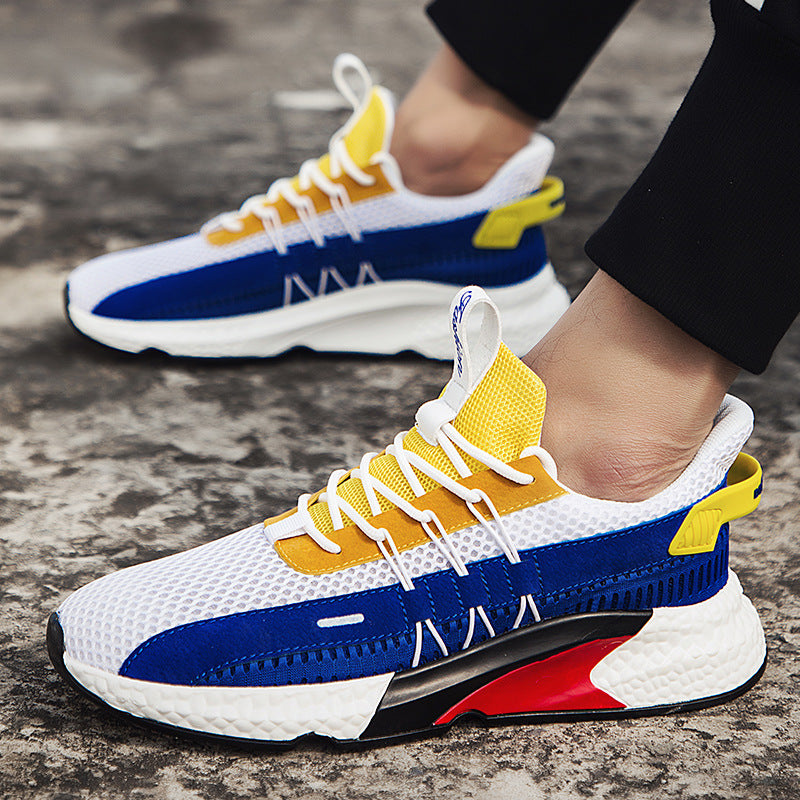 Colorful sneakers with blue, yellow, and red design on a textured surface