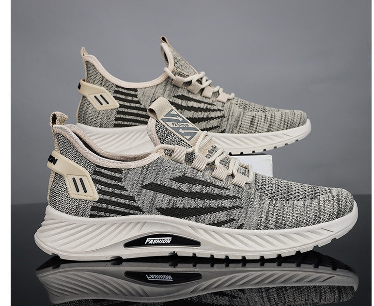 Gray and white athletic shoes with 'Fusion' branding on a reflective surface.