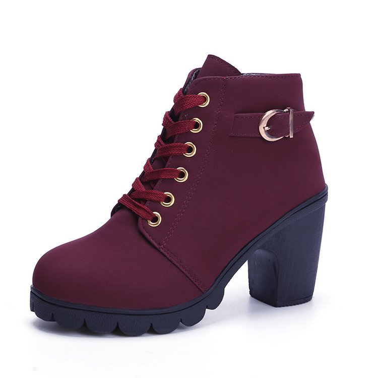 Maroon ankle boot with a block heel on a white background