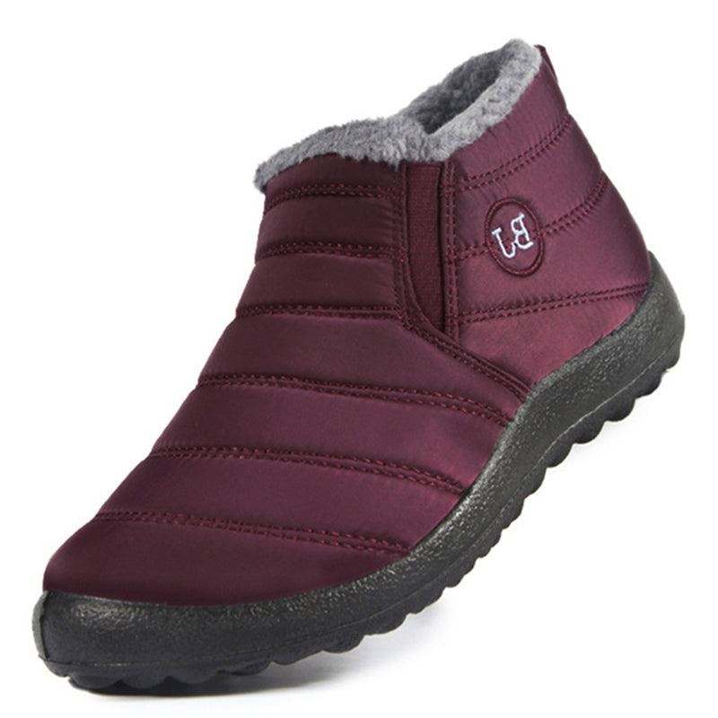 Maroon winter boot with gray lining on a white background