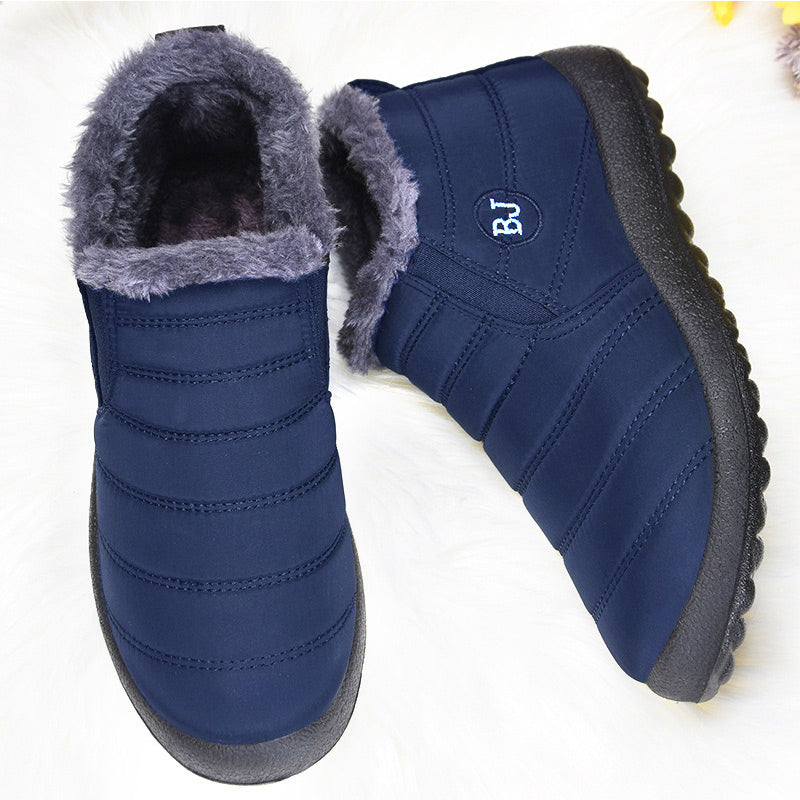 Pair of blue winter boots with gray fur lining on a white background