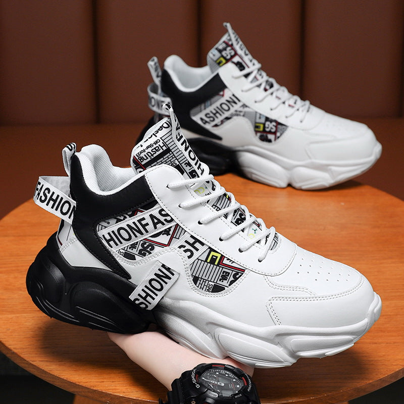 White sneakers with black and multicolor text on a wooden surface